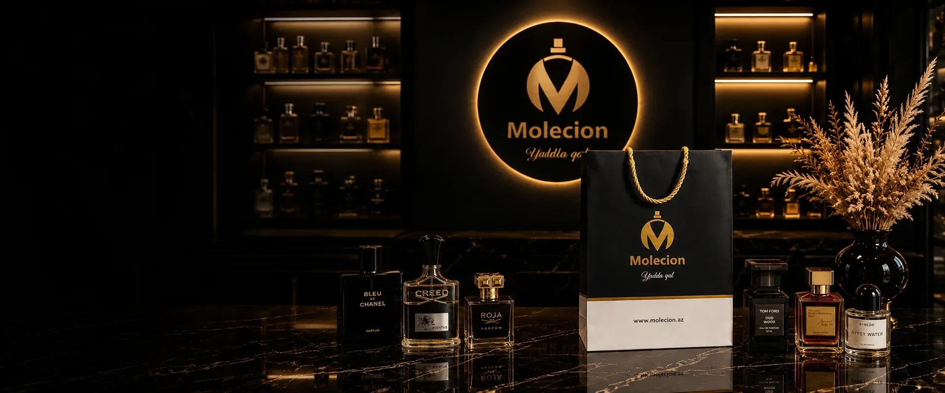 The Molecion storefront: a lit boutique wall of fragrance bottles, the gold monogram and the brand’s own carrier bag on black marble.